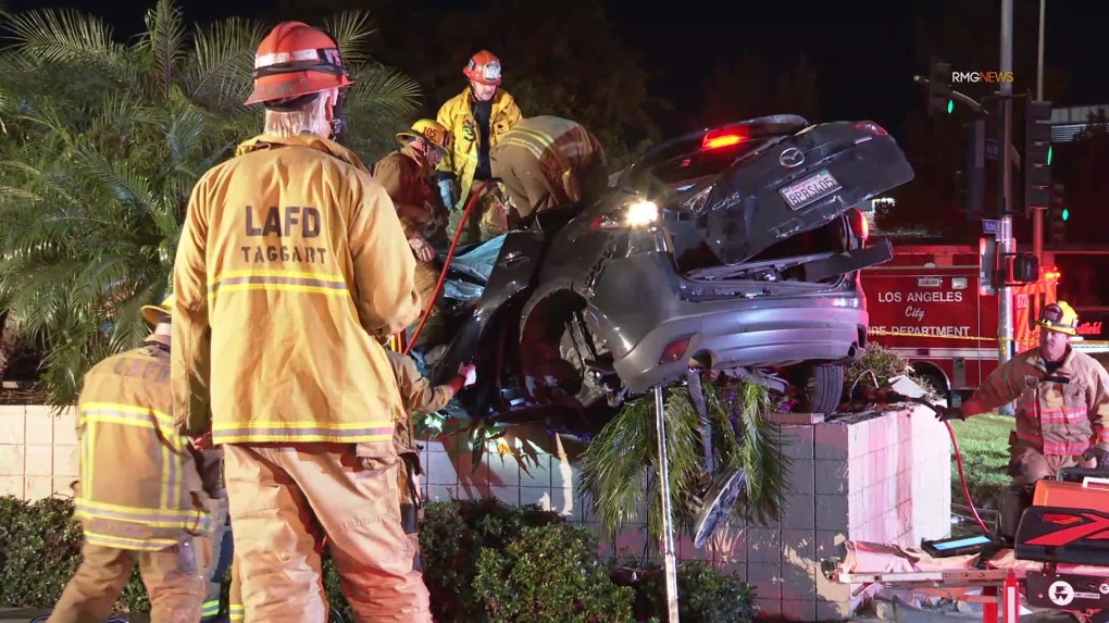 Driver killed after SUV crashes, lands on top of planter in Woodland Hills